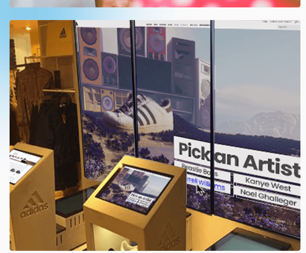 In-store iPad kiosk slotted between Adidas shelves